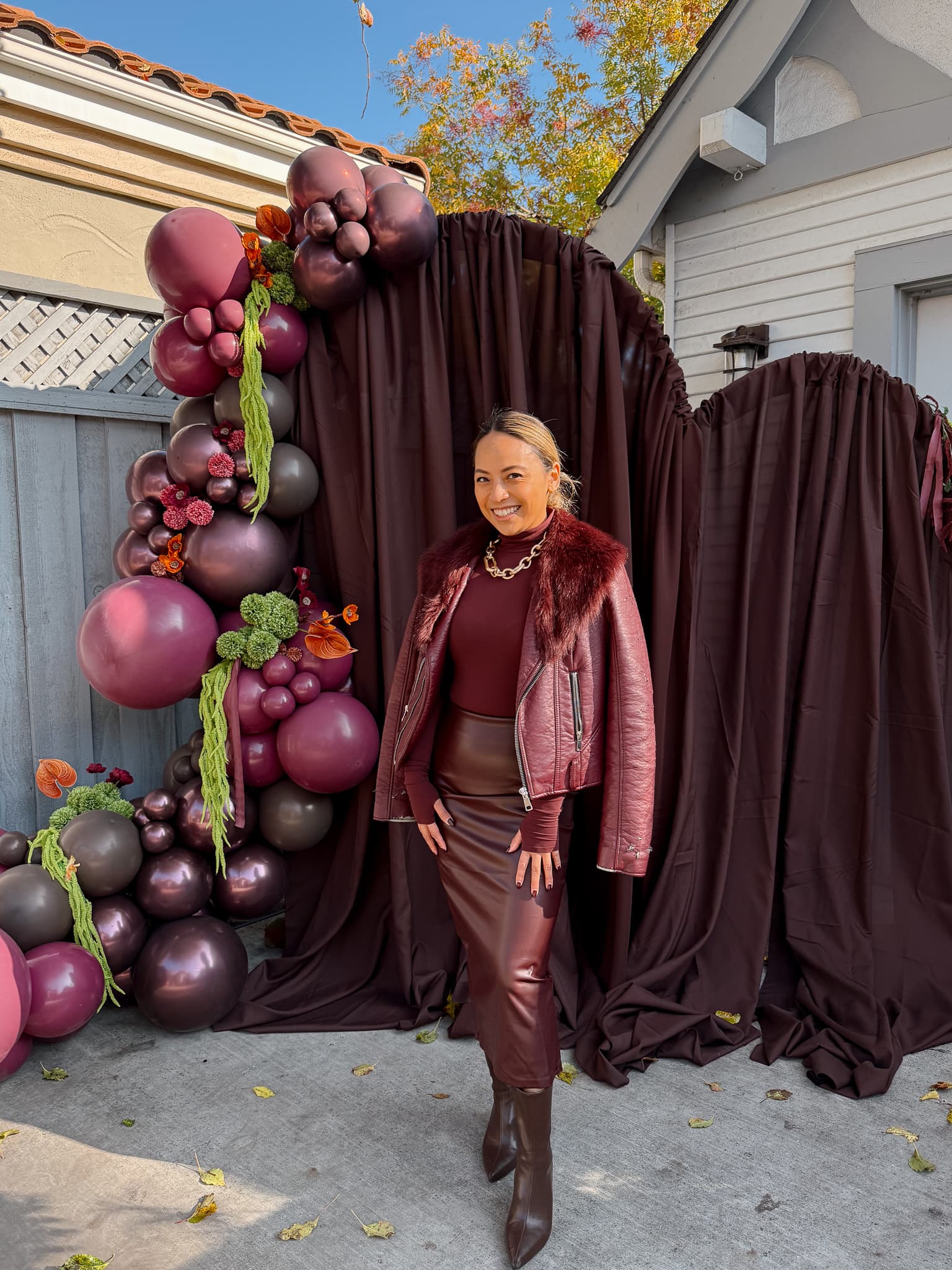 Elegant balloon installation with burgundy and champagne balloons for a luxurious event
